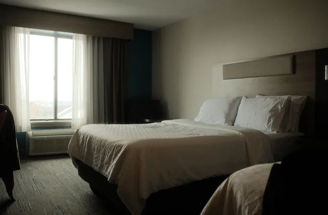 Made hotel bed with pillows in soft daylight