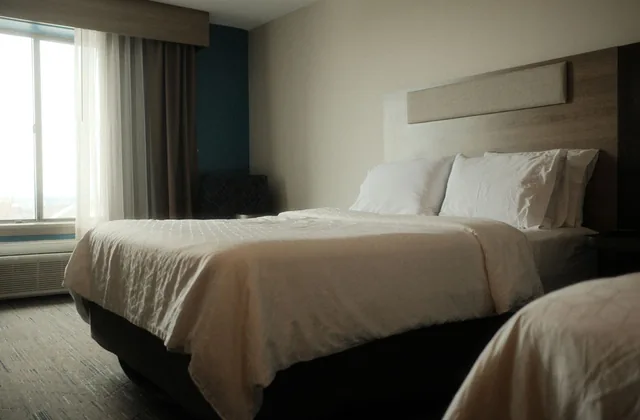 Hotel room corner with a chair in window light